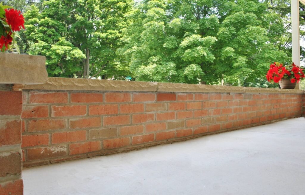 Brick-face retaining wall along a commercial parking area in Ann Arbor, MI