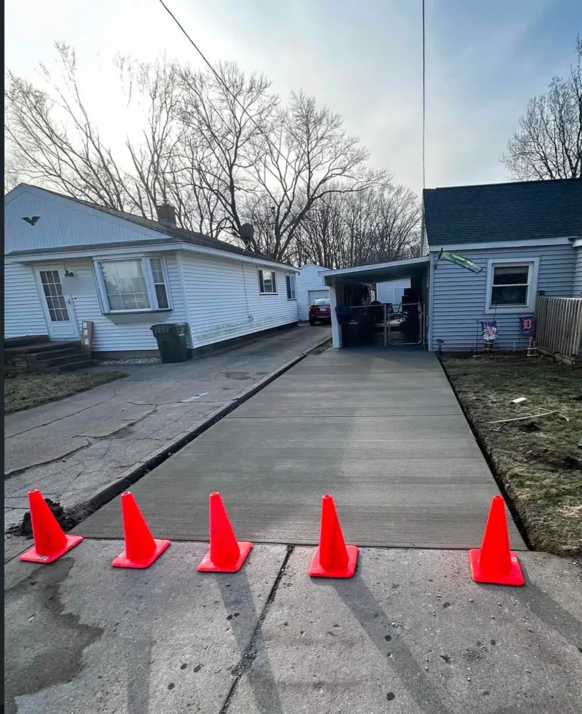 After: new broom finish concrete driveway replacement in Ann Arbor, MI