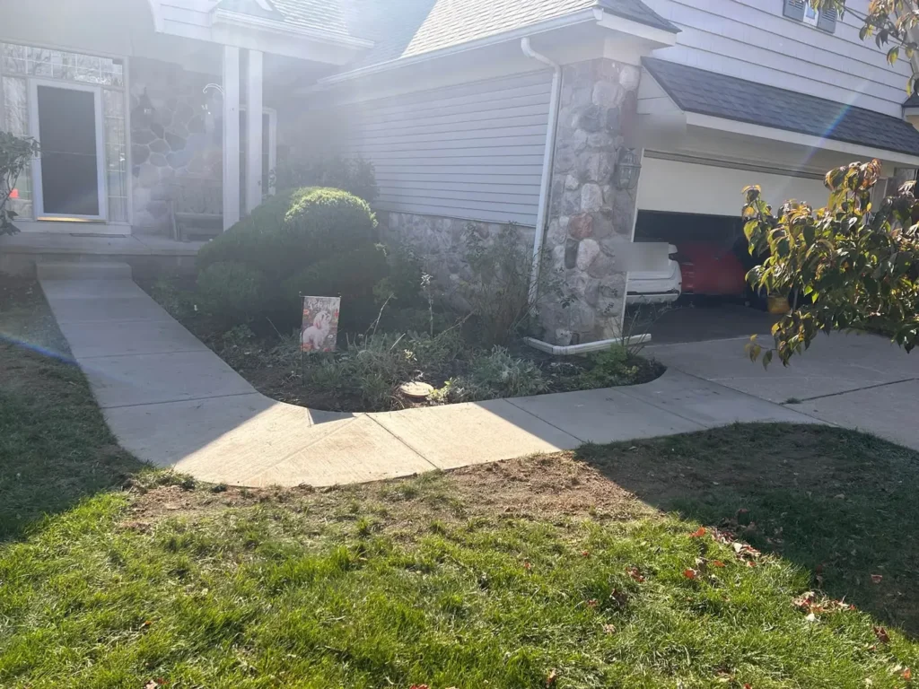 After: new front concrete walkway from porch to driveway in Ann Arbor, MI