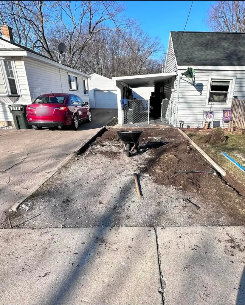 Before: old driveway removed and base prepped for concrete driveway replacement in Ann Arbor, MI