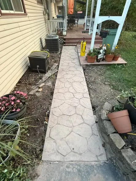 Before: unsealed stamped flagstone concrete walkway in Ann Arbor, MI