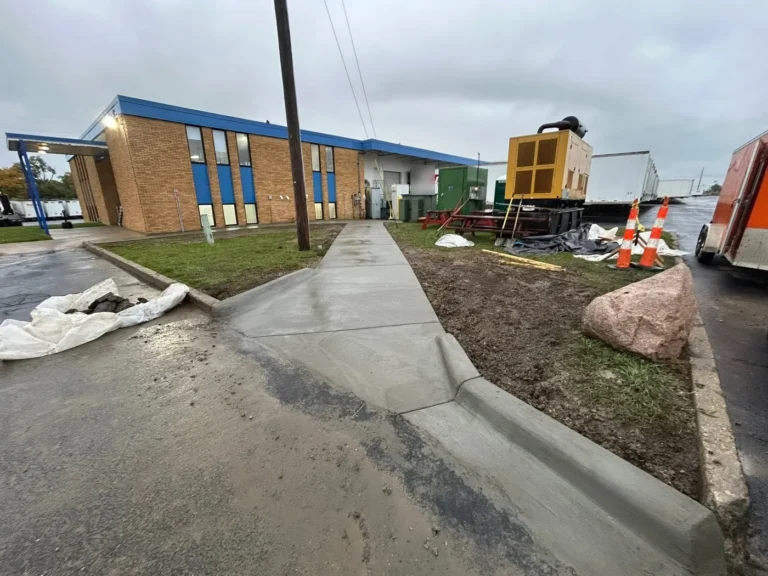Commercial concrete walkway and curb cut in Arborland, Ann Arbor MI