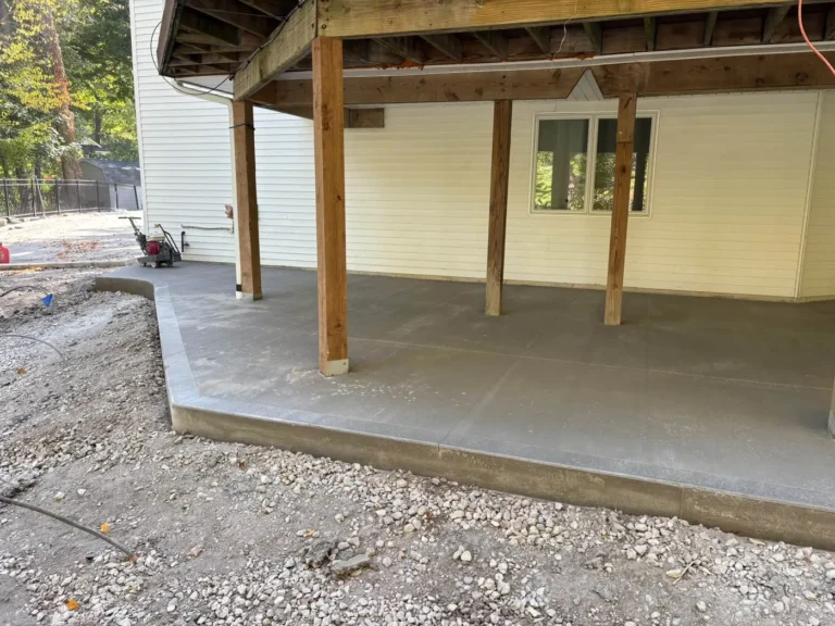 New concrete patio poured under a deck in Ann Arbor, MI