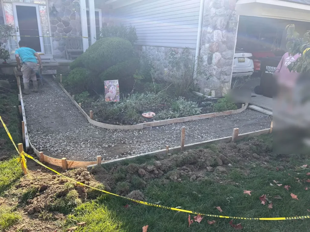 Curved concrete walkway forms set at a home in Georgetown, Ann Arbor MI