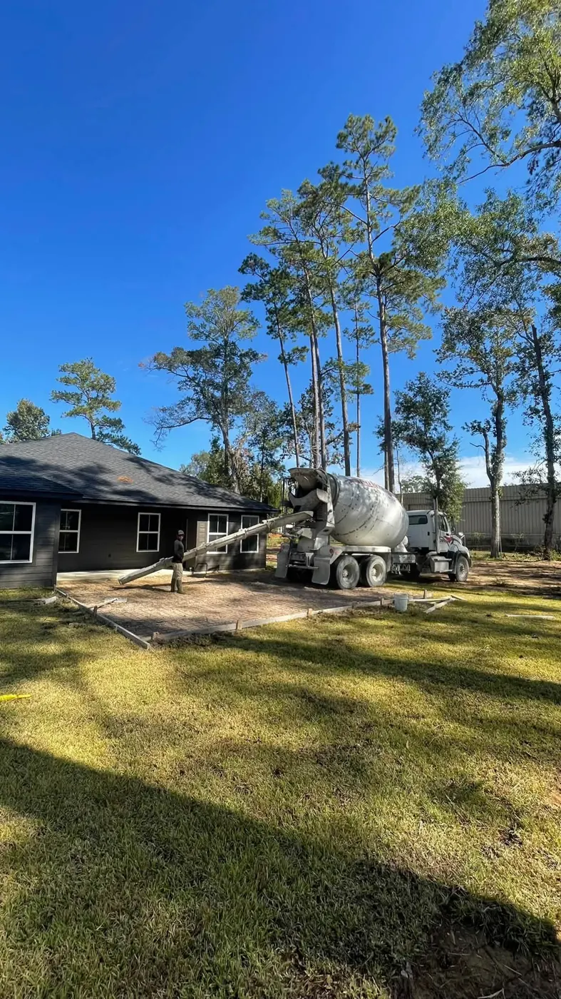 Ready-mix truck pouring a new backyard concrete patio in Ann Arbor, MI