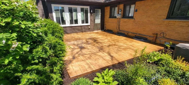 Stamped concrete patio beside a brick home in Burns Park, Ann Arbor MI